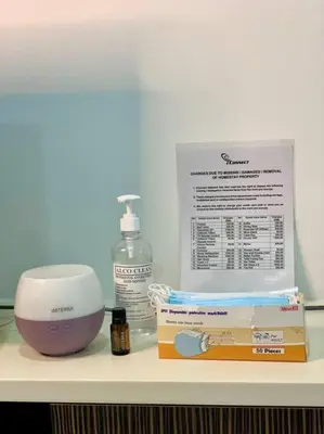 a counter with a mixer and a bottle of essential oils at Private Jacuzzi Staycation at KL City 152 in Kuala Lumpur