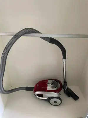 a red and black vacuum sitting on top of a counter at Private Jacuzzi Staycation at KL City 152 in Kuala Lumpur