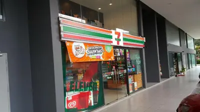 a store front of a store with signs on the wall at MCity Jalan Ampang KLCC in Kuala Lumpur