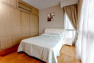 a bedroom with a white bed and a window at Rex Ollie @ Myhabitat Condominium in Kuala Lumpur