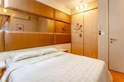 a bedroom with a large bed and a mirror at Rex Ollie @ Myhabitat Condominium in Kuala Lumpur