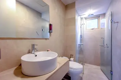 a bathroom with a sink and a shower and a toilet at Rex Ollie @ Myhabitat Condominium in Kuala Lumpur