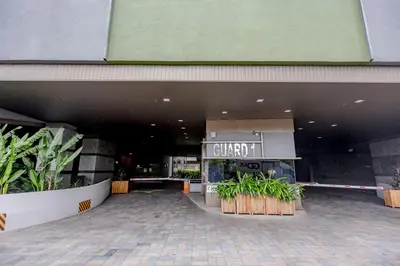 an entrance to a building with plants in front of it at Rex Ollie @ Myhabitat Condominium in Kuala Lumpur