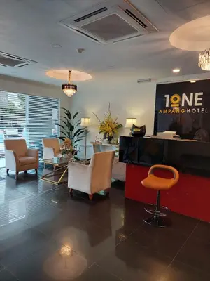 a lobby with chairs and a sign in a hotel at ONE AMPANG HOTEL in Ampang