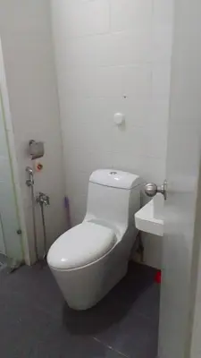 a bathroom with a white toilet and a sink at Vue Residence Servis Suite 3 pax Studio in Kuala Lumpur