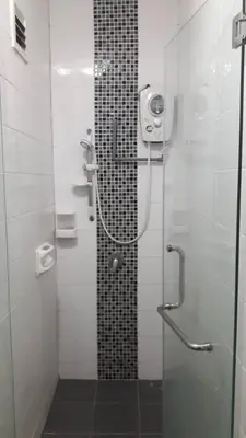 a bathroom with a shower with a glass door at Vue Residence Servis Suite 3 pax Studio in Kuala Lumpur