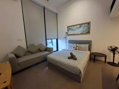 a bedroom with a bed and a couch at KL Sentral Loft, EST Bangsar #3, LRT in Kuala Lumpur