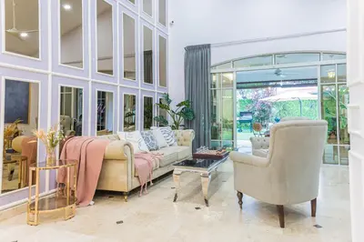 a living room with a couch and two chairs at 25P Enchanting Bungalow Retreat - Mystical Garden,Petaling Jaya by Verano in Petaling Jaya