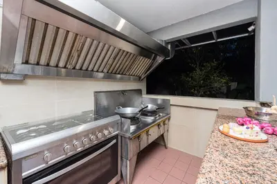 a kitchen with a stove and some pots and pans at 25P Enchanting Bungalow Retreat - Mystical Garden,Petaling Jaya by Verano in Petaling Jaya