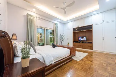 a bedroom with a bed and a tv in it at 25P Enchanting Bungalow Retreat - Mystical Garden,Petaling Jaya by Verano in Petaling Jaya