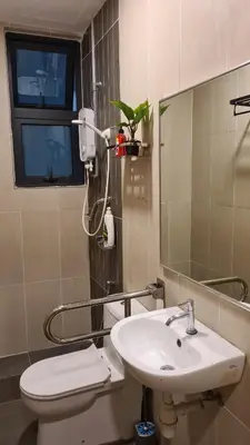 a bathroom with a sink and a toilet and a mirror at Rumah Kampong Bharu near KLCC (3Rooms) in Kuala Lumpur