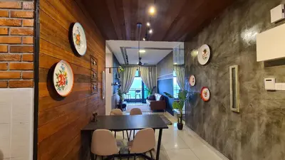 a dining room with a table and plates on the wall at Rumah Kampong Bharu near KLCC (3Rooms) in Kuala Lumpur
