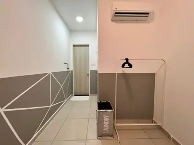 a hallway with a trash can in a building at Legasi Kampung Baru apartment by Rumahrehat twin tower view in Kuala Lumpur