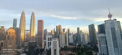 a view of a city skyline with tall buildings at Legasi Kampung Baru apartment by Rumahrehat twin tower view in Kuala Lumpur