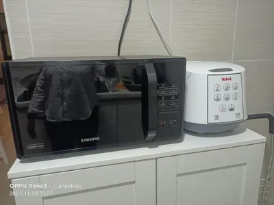 a microwave oven sitting on top of a counter at Legasi Kampung Baru apartment by Rumahrehat twin tower view in Kuala Lumpur