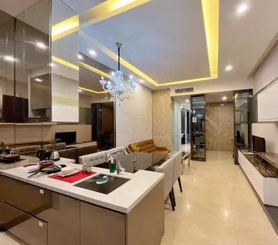 a kitchen and living room with a large island in a room at Nana's at Dorsett Residence Bukit Bintang in Kuala Lumpur