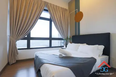 a bedroom with a bed with a large window at Astoria Ampang in Kuala Lumpur