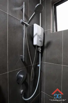 a shower with a blow dryer in a bathroom at Astoria Ampang in Kuala Lumpur