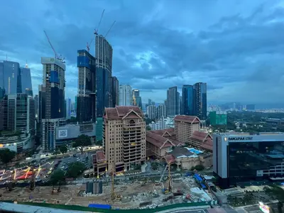 a city skyline with tall buildings in the foreground at Dorsett Residence Service Suite At Bukit Bintang KL in Kuala Lumpur
