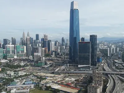 an aerial view of a city with a tall skyscraper at Continew Residence by HomeBrickz in Kuala Lumpur