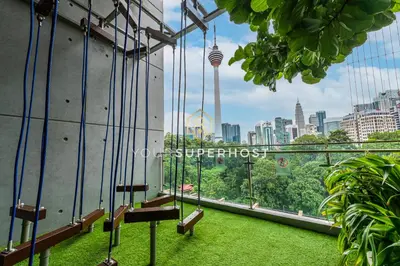 a balcony with a view of the city at Ceylonz Suites nr Pavilion & KLCC by YourSuperhost in Kuala Lumpur