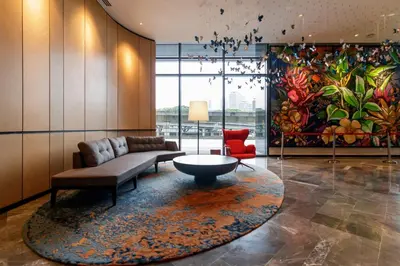 a living room with a couch and a rug at ViiA Residences Kuala Lumpur, Five Senses in Kuala Lumpur