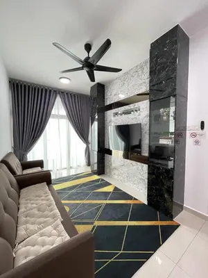 a living room with a couch and a fireplace at Legasi Kampung Baru apartment by rumahrehat in Kuala Lumpur