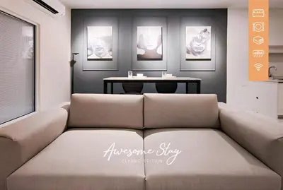 a living room with a couch and a table at Nj Homestay at Arte Mont Kiara in Kuala Lumpur