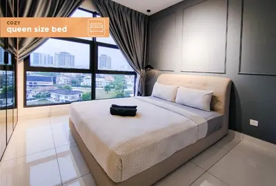a bedroom with a large bed with a large window at Nj Homestay at Arte Mont Kiara in Kuala Lumpur