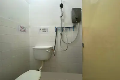 a shower in a bathroom with a toilet at Hotel O Syariah Asam Pedas in Kuala Lumpur