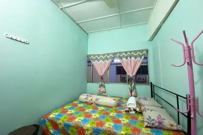 a bedroom with a bed in a blue room at Hotel O Syariah Asam Pedas in Kuala Lumpur