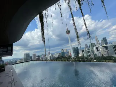 a view of the city from the rooftop of a skyscraper at Ceylonz Suite Official in Kuala Lumpur