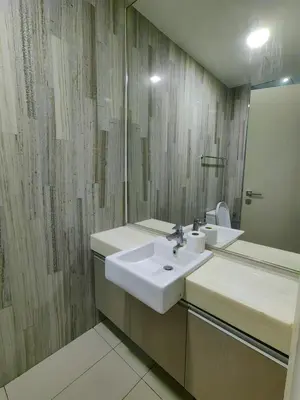 a bathroom with two sinks and a mirror at M City 2 DUPLEX BEDROOM KLCC in Kuala Lumpur