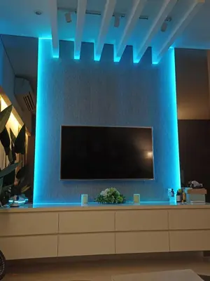 a large tv on a blue wall at KLCC Gem walk to all in Kuala Lumpur