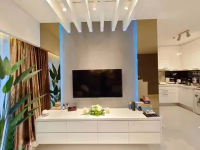a living room with a large tv on a wall at KLCC Gem walk to all in Kuala Lumpur