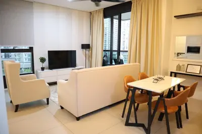 a living room with a couch and a table and chairs at New Arcoris 6 Pax 2 BR with Pool View Mont Kiara - BOHO in Kuala Lumpur