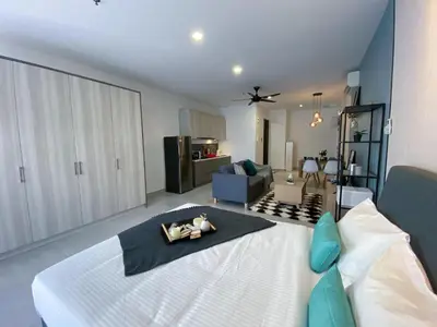 a living room with a large white bed in a room at Lily and Loft - Queensville @ Kuala Lumpur - Netflix in Kuala Lumpur