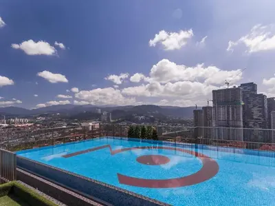 a large swimming pool on top of a building at 3 Towers Klcc By Tenang Homes in Kuala Lumpur