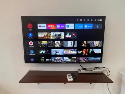 a flat screen tv hanging on a wall at 3 Towers Klcc By Tenang Homes in Kuala Lumpur