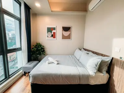 a bedroom with a bed with a white bow on it at TRX Garden View TriBeCa 3min walk2 Pavillion 2bedroom in Kuala Lumpur