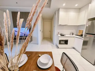 a kitchen and living room with a table and chairs at TRX Garden View TriBeCa 3min walk2 Pavillion 2bedroom in Kuala Lumpur