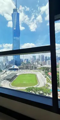 a view of a soccer field from a window at Opus Residences Warisan Merdeka by C&C Fortune in Kuala Lumpur