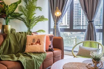 a living room with a couch and a table at 2min walk to Lot 10, 5 min to Pavillion 2BR 8-2 WIFI 100mbps in Kuala Lumpur