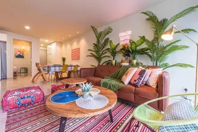 a living room with a couch and a table at 2min walk to Lot 10, 5 min to Pavillion 2BR 8-2 WIFI 100mbps in Kuala Lumpur