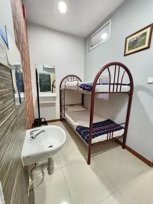 a bathroom with two bunk beds and a sink at Holiday Hostel KLCC in Kuala Lumpur