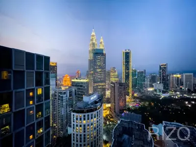 a city skyline at night with tall buildings at SOHO SUITES KLCC by Wonder Home in Kuala Lumpur