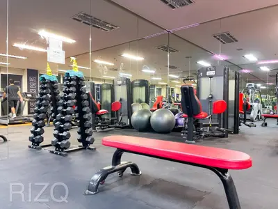 a gym with a bench and lots of machines at SOHO SUITES KLCC by Wonder Home in Kuala Lumpur