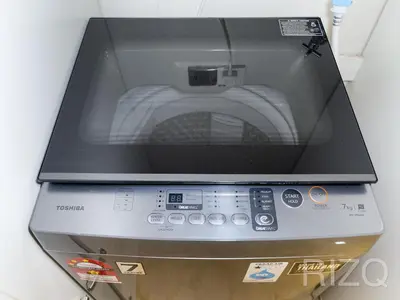a microwave sitting on top of a counter at SOHO SUITES KLCC by Wonder Home in Kuala Lumpur