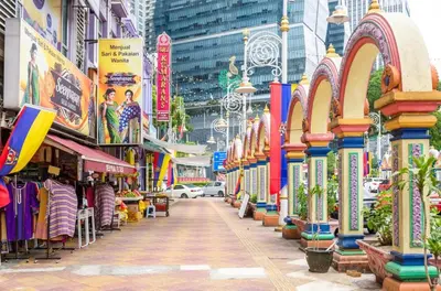 a street in a city with shops and buildings at KL Sentral Loft, EST Bangsar #6, LRT in Kuala Lumpur