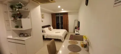 a small room with a bed and a table at Taragon BBCC in Kuala Lumpur